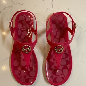 Coach pink thong sandals with coach gold emblem